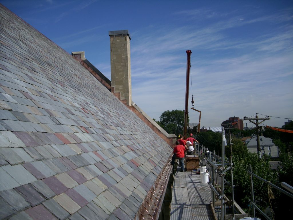 roofing contractor working on slate roof