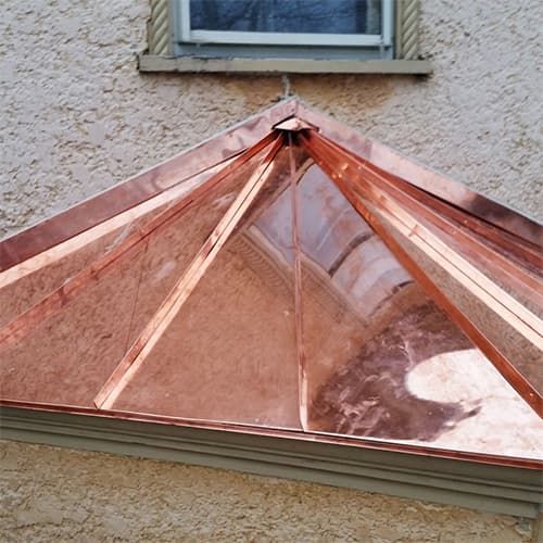 Photo of a custom copper pyramid shaped roof structure